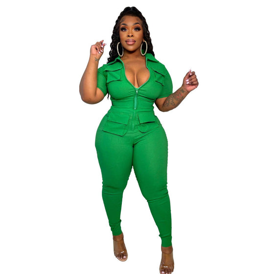 Women's green zipper jumpsuit with three-dimensional pocket design.