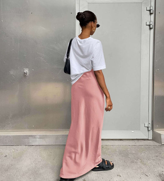 Women's Fashion Casual Satin Ice Silk Skirt in pink, styled with a white top.