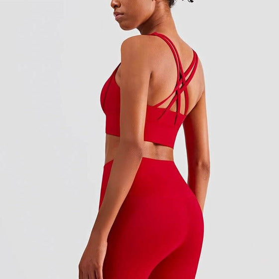 Plush sports accessories two-piece yoga suit in Chinese red with cross-backless bra and cropped pants.