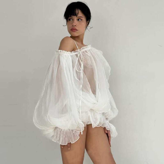 See-through flared sleeves top in white with elegant bell sleeves.