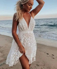  Women Sexy Floral White Mini Lace Backless Sheer Dress on the beach with spaghetti straps and V-neck.