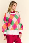 Davi & Dani Exposed Seam Color Block Sweater with bold geometric design and relaxed fit.