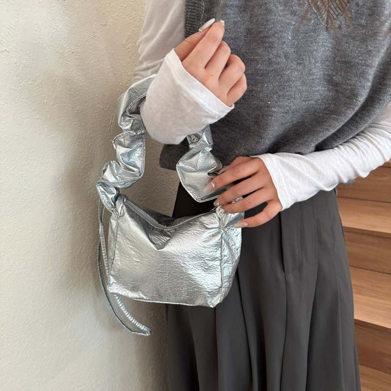 Stylish small PU leather drawstring shoulder bag in silver, ideal for essentials.