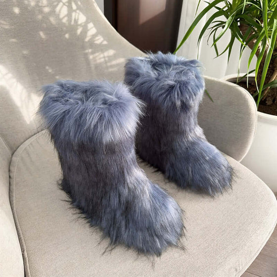 Women's closed toe plush snow boots in gray fur, providing warmth and style for winter. Perfect for cozy looks.