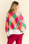 Davi & Dani Exposed Seam Color Block Sweater with vibrant geometric design and relaxed fit.