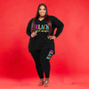 Plus size sports printed two-piece set for women, stylish black top and leggings, activewear.