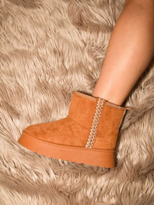  WILD DIVA Round Toe Platform Boots with suede finish and platform heel on plush carpet.