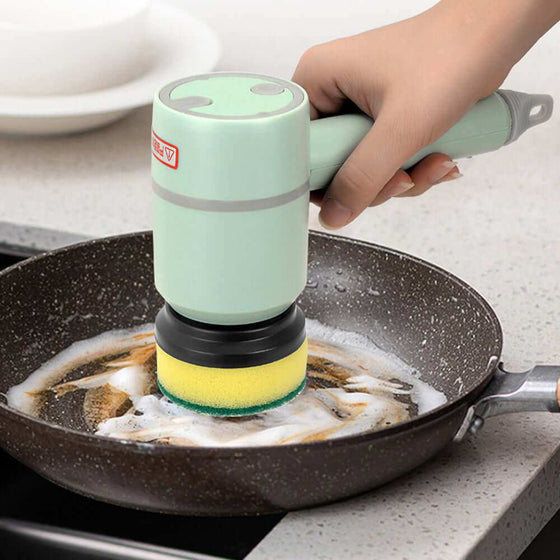 Electric cleaning dishwashing brush in use on a frying pan, cordless with interchangeable heads.