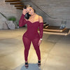 Women's romper jumpsuit with sheer mesh patchwork on bodice and long sleeves.