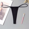 Women's minimalist low waisted underwear, T-back style, black, polyester cotton blend.