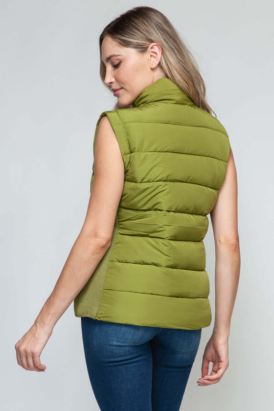 Snobbish Zip Up Turtleneck Vest with PocketsComplete your wardrobe with our Snobbish Zip Up Turtleneck Vest! With a stylish zip-up front and cozy turtleneck, this vest offers both fashion and warmth. The additCoatsPlush Fashion ShopPlush Fashion ShopSnobbish Zip