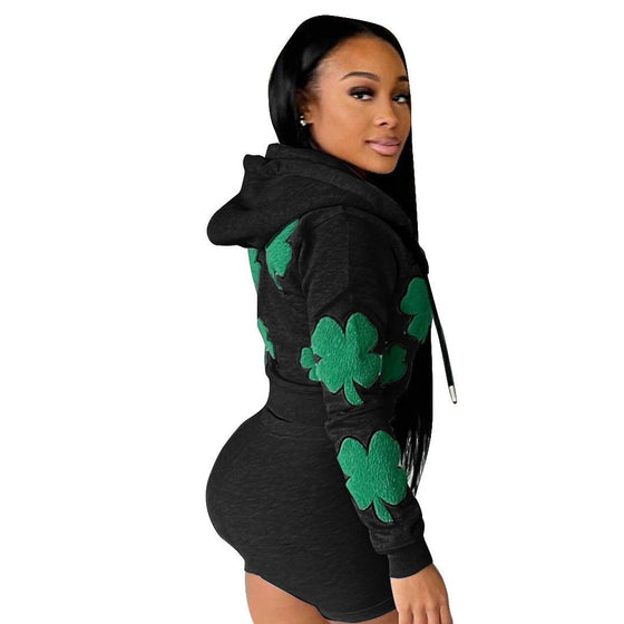 Women's sports two-piece set short suit in black with green clover design, cotton blend, flattering fit.