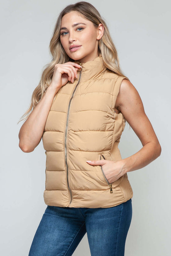 Snobbish Zip Up Turtleneck Vest with PocketsElevate your outfit with the Snobbish Zip Up Turtleneck Vest with Pockets. Designed with a convenient zip-up front closure and cozy turtleneck, this versatile vest oVestPlush Fashion ShopPlush Fashion ShopSnobbish Zip