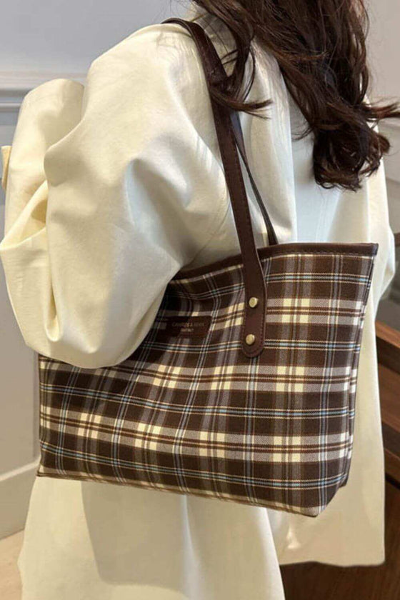 Plaid leather tote bag for women with chic design and spacious interior.