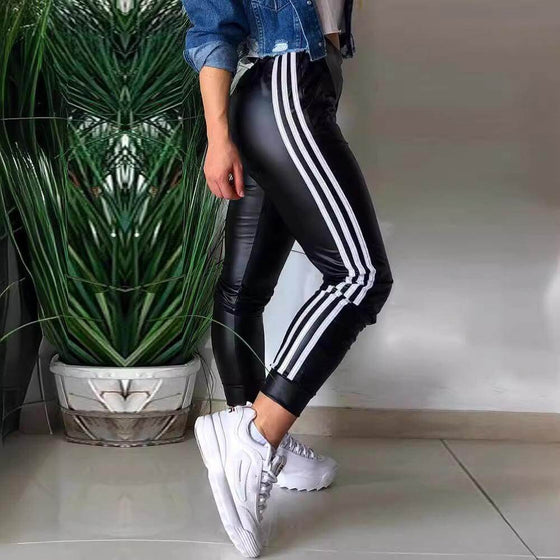 Women's PU side ribbon stitching casual trousers with high-waist design and pocket detailing.