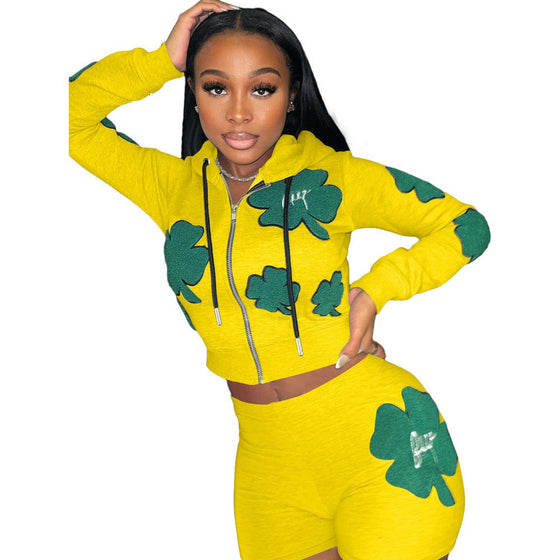 Women's sports two-piece set short suit, vibrant print, cotton blend, trendy yellow with green patterns.