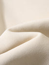 Close-up of fabric texture for a solid color round neck long sleeve sweatshirt.