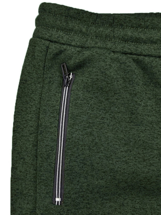 Men's green sports trousers with cationic design and zipper cuffs.