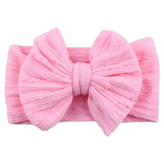 Newborn Solid Cable Baby Bow Headband for ChildEnhance any outfit with our Solid Cable Bow Baby Headband! Stretchy, soft Nylon material won't hurt your baby's head and will grow with them. Available in 20 colors,HairbowsPlush Fashions ShopPlush Fashion ShopNewborn Solid Cable Baby Bow Headband