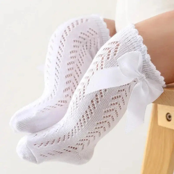 Baby Girls Long Bow SockWrap your little one's feet in soft cotton with our Baby Girls Long Bow Sock. These knee-highs feature a Spanish-inspired design with delicate lace detailing, perfecSocksPlush Fashions ShopPlush Fashion ShopBaby Girls Long Bow Sock