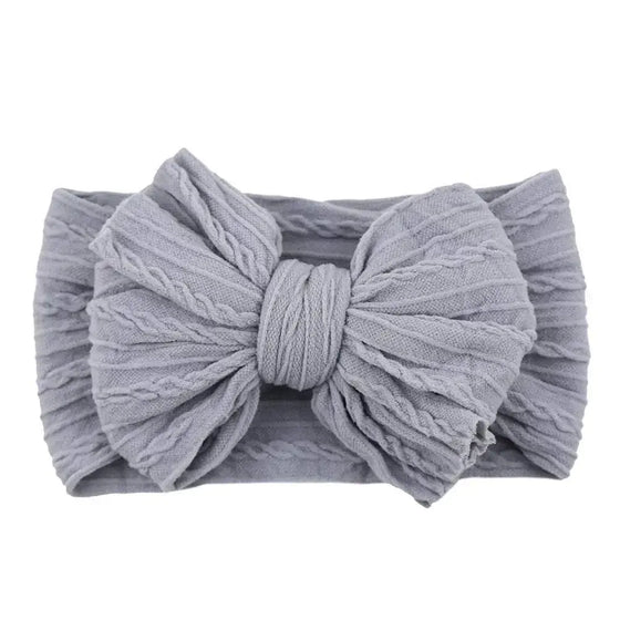 Newborn Solid Cable Baby Bow Headband for ChildEnhance any outfit with our Solid Cable Bow Baby Headband! Stretchy, soft Nylon material won't hurt your baby's head and will grow with them. Available in 20 colors,HairbowsPlush Fashions ShopPlush Fashion ShopNewborn Solid Cable Baby Bow Headband