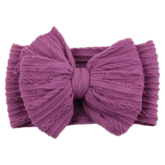 Newborn Solid Cable Baby Bow Headband for ChildEnhance any outfit with our Solid Cable Bow Baby Headband! Stretchy, soft Nylon material won't hurt your baby's head and will grow with them. Available in 20 colors,HairbowsPlush Fashions ShopPlush Fashion ShopNewborn Solid Cable Baby Bow Headband