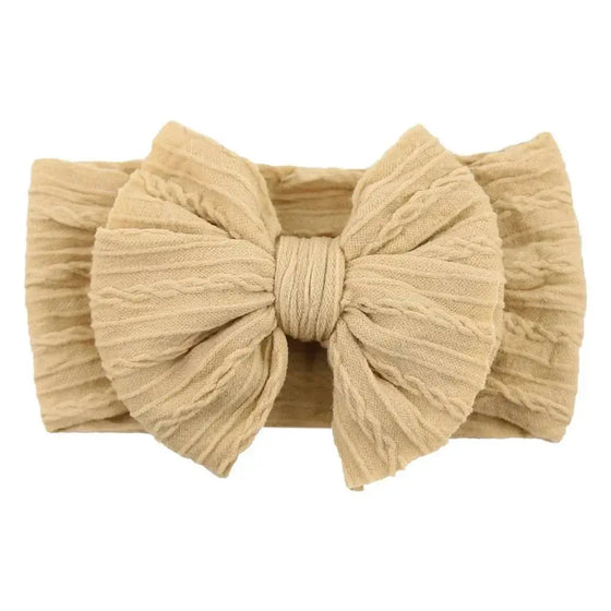 Newborn Solid Cable Baby Bow Headband for ChildEnhance any outfit with our Solid Cable Bow Baby Headband! Stretchy, soft Nylon material won't hurt your baby's head and will grow with them. Available in 20 colors,HairbowsPlush Fashions ShopPlush Fashion ShopNewborn Solid Cable Baby Bow Headband