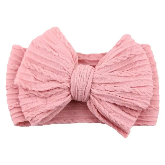 Newborn Solid Cable Baby Bow Headband for ChildEnhance any outfit with our Solid Cable Bow Baby Headband! Stretchy, soft Nylon material won't hurt your baby's head and will grow with them. Available in 20 colors,HairbowsPlush Fashions ShopPlush Fashion ShopNewborn Solid Cable Baby Bow Headband