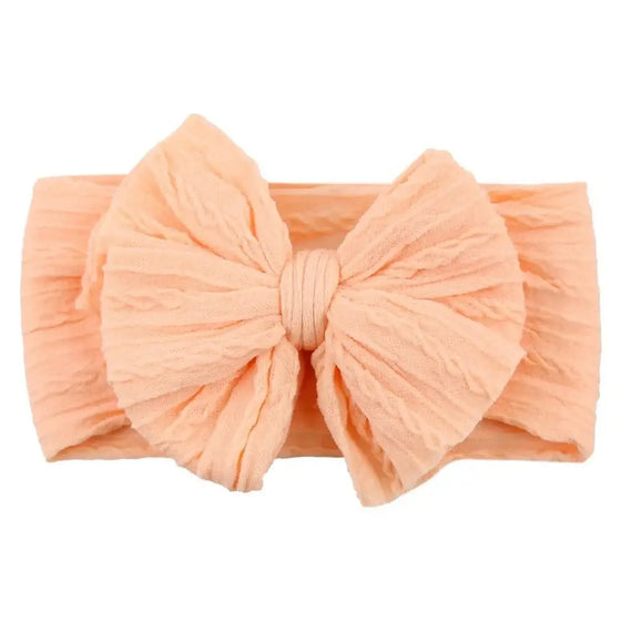 Newborn Solid Cable Baby Bow Headband for ChildEnhance any outfit with our Solid Cable Bow Baby Headband! Stretchy, soft Nylon material won't hurt your baby's head and will grow with them. Available in 20 colors,HairbowsPlush Fashions ShopPlush Fashion ShopNewborn Solid Cable Baby Bow Headband