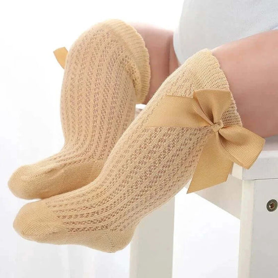 Baby Girls Long Bow SockWrap your little one's feet in soft cotton with our Baby Girls Long Bow Sock. These knee-highs feature a Spanish-inspired design with delicate lace detailing, perfecSocksPlush Fashions ShopPlush Fashion ShopBaby Girls Long Bow Sock